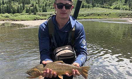 Clancy with a Slough Creek cutthroat.